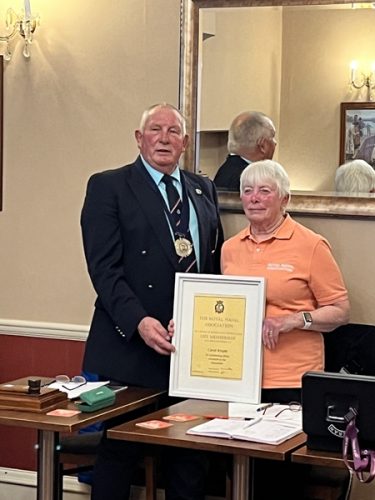 Branch Chairman Shipmate Richard Hallowes pre sents shipmate Carol Wright with Life Membership